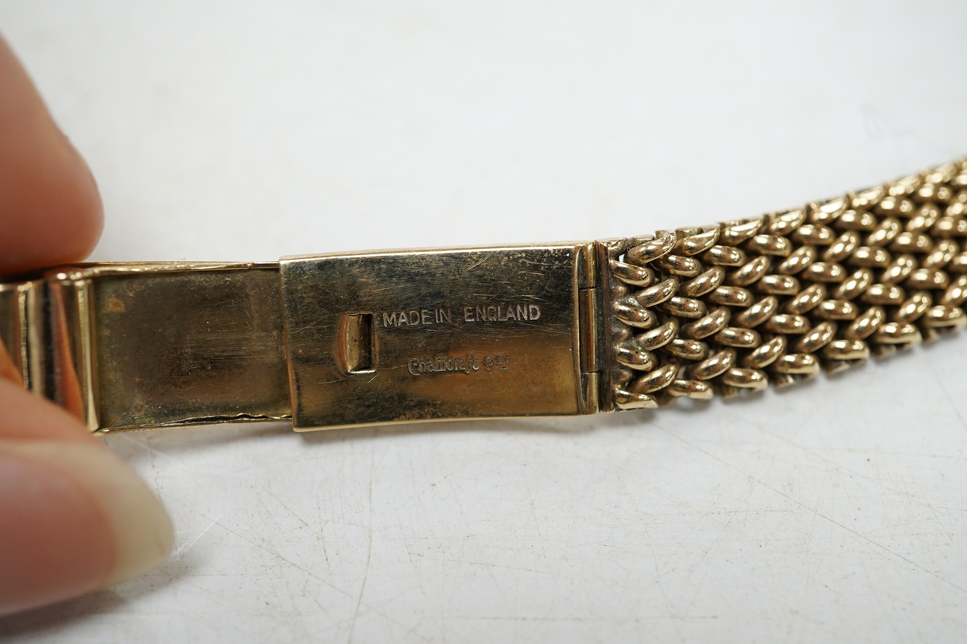 A lady's 9ct gold Omega manual wind wrist watch, on an associated 9ct bracelet, with Arabic and dot numerals, case diameter 20mm, overall length 16.7cm, gross weight 30 grams., no box or papers, with spare bracelet parts